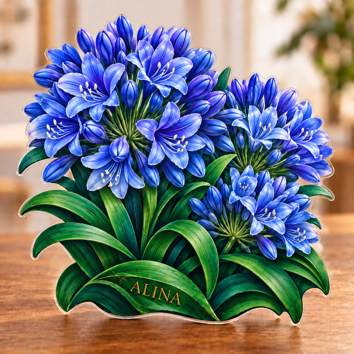 Digital preview of an agapanthus-shaped acrylic plaque with ALINA integrated along the lowest illustrated emerald leaf