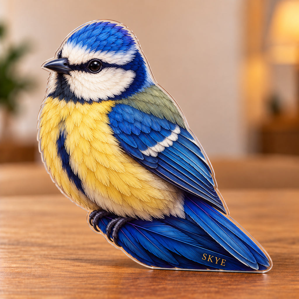 Digital preview of a blue tit-shaped acrylic plaque with SKYE integrated along its lowest illustrated feather detail
