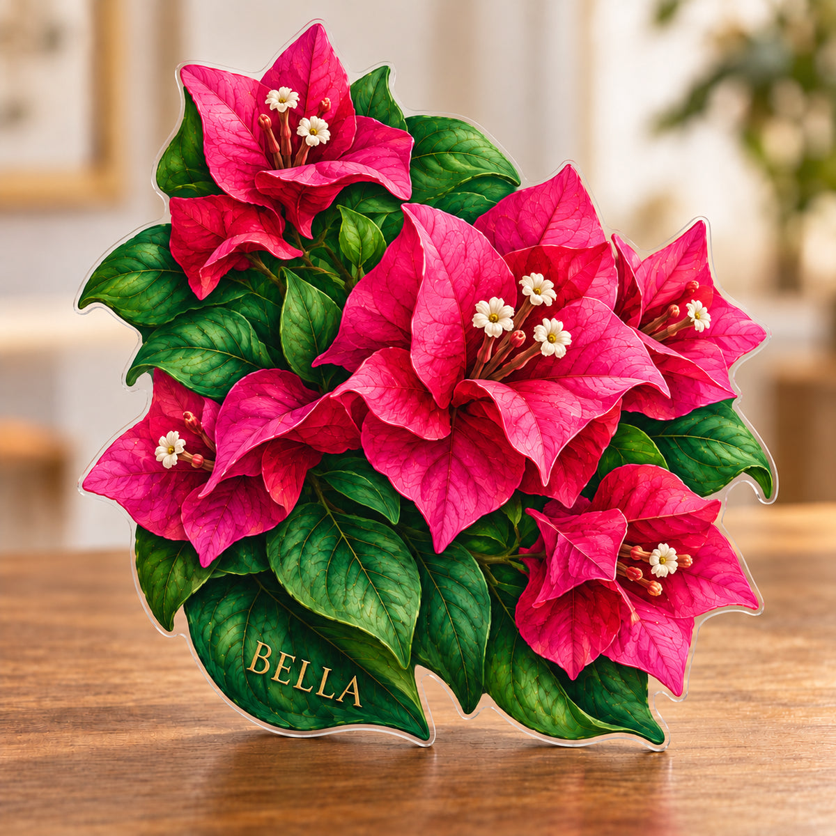 Digital preview of a bougainvillea blossom-shaped acrylic plaque with BELLA integrated along its lowest illustrated subject detail