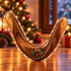 Front-view digital preview of a Christmas boomerang outdoor joy acrylic plaque with example name Arlo integrated into the the illustrated lower wood grain name detail