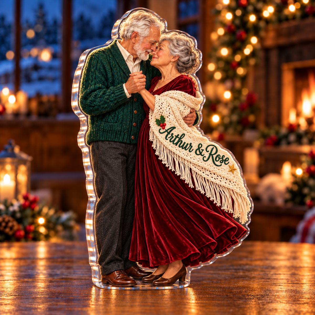 Front-view digital preview of a Christmas christmas dance couple acrylic plaque with example name Arthur & Rose integrated into the embroidered shawl fold