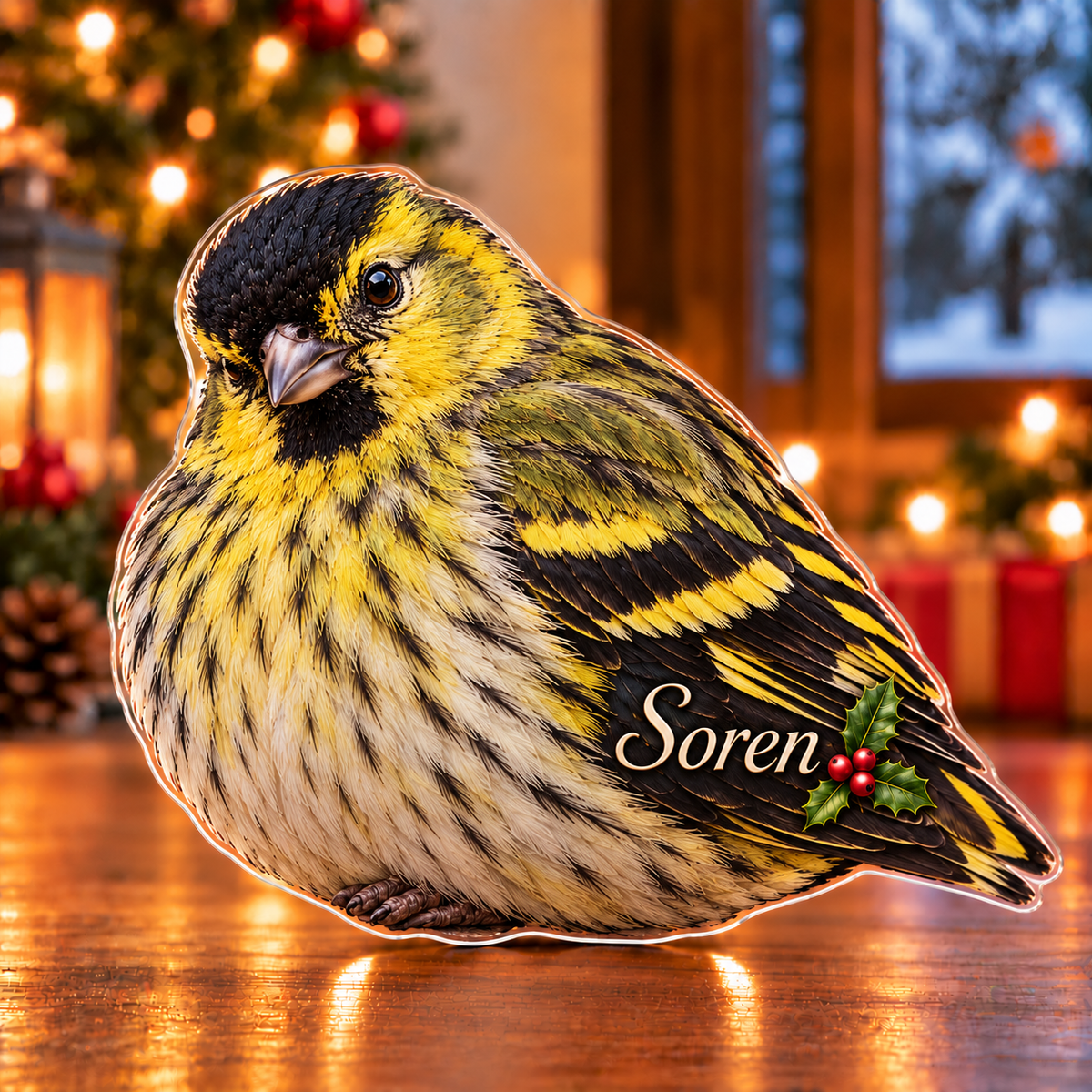Front-view digital preview of a Christmas siskin golden note acrylic plaque with example name Soren integrated into the lower folded wing