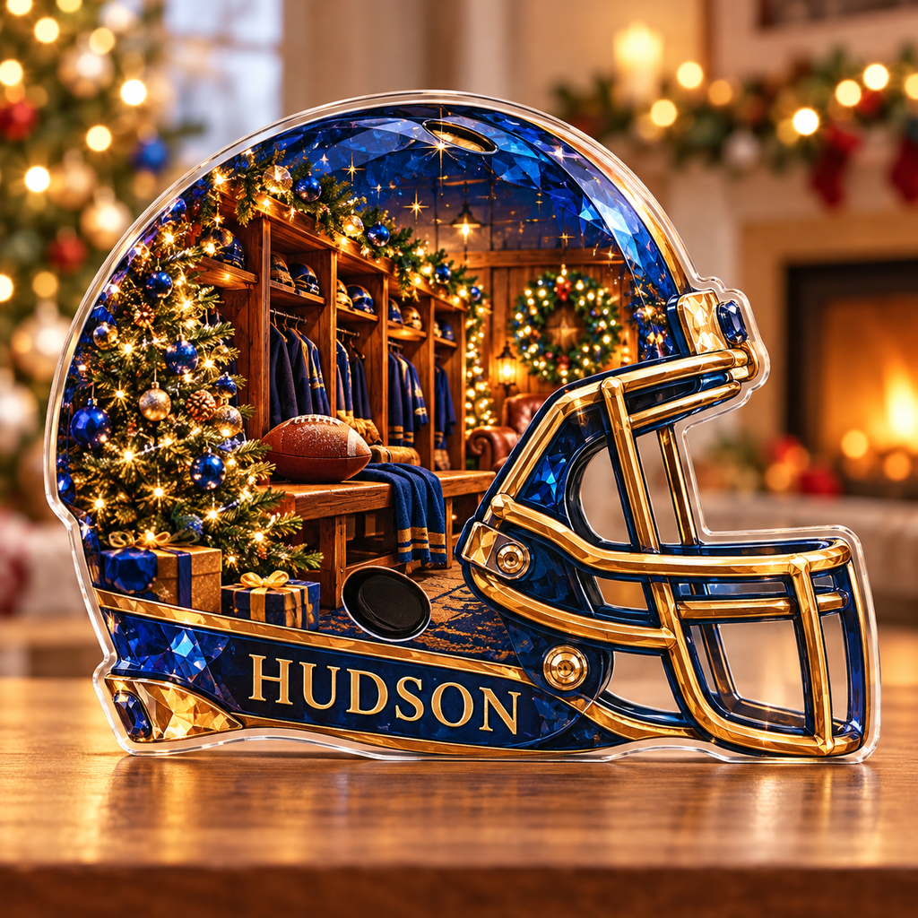 Front-view digital preview of a Christmas football helmet sapphire clubhouse acrylic plaque with example name Hudson integrated into the lower intrinsic helmet trim detail