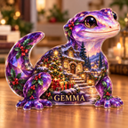 Front-view digital preview of a Christmas amethyst gecko acrylic plaque with example name GEMMA integrated into the lowest body facets