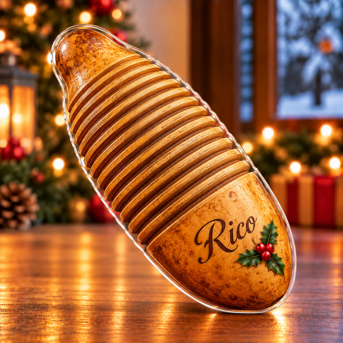 Front-view digital preview of a Christmas guiro warm rhythm acrylic plaque with example name Rico integrated into the smooth lower gourd area