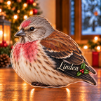 Front-view digital preview of a Christmas linnet heather song acrylic plaque with example name Linden integrated into the lower folded wing