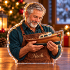 Front-view digital preview of a Christmas shipwright harbor pride acrylic plaque with example name Noah integrated into the shipwright apron front name embroidery