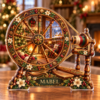 Front-view digital preview of a Christmas spinning wheel amber hearth acrylic plaque with example name Mabel integrated into the lower wheel floral detail