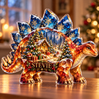 Front-view digital preview of a Christmas stegosaurus amber giftgrove acrylic plaque with example name STEVIE integrated into the lower flank facets