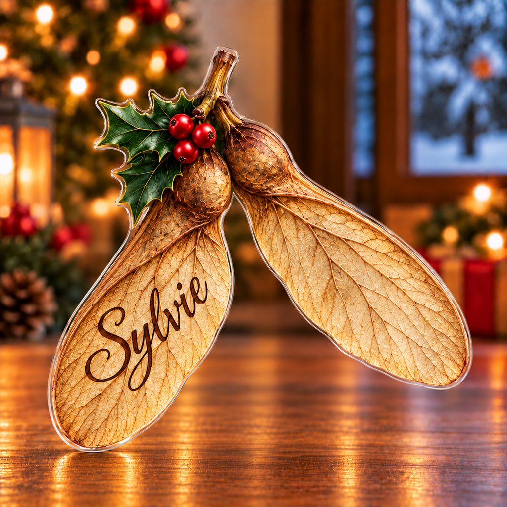 Front-view digital preview of a Christmas sycamore winged wish acrylic plaque with example name Sylvie integrated into the broad near seed wing