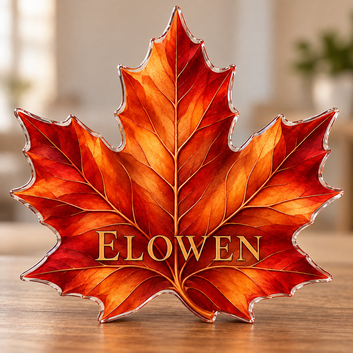 Digital preview of a copper-orange maple leaf subject-shaped acrylic plaque with ELOWEN across the lower illustrated leaf