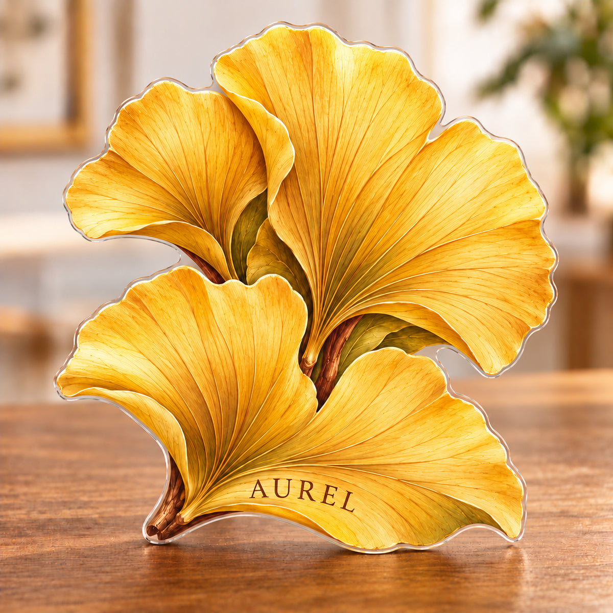 Digital preview of a ginkgo-leaf-shaped acrylic plaque with AUREL integrated along its lowest illustrated golden leaf