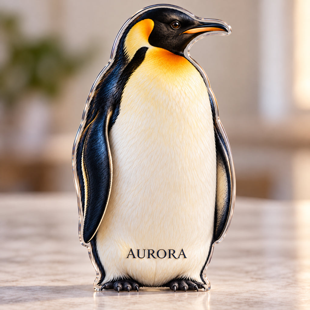 Front-view digital preview of a golden-neck penguin subject-shaped acrylic plaque with AURORA printed on its lowest intrinsic ivory belly surface