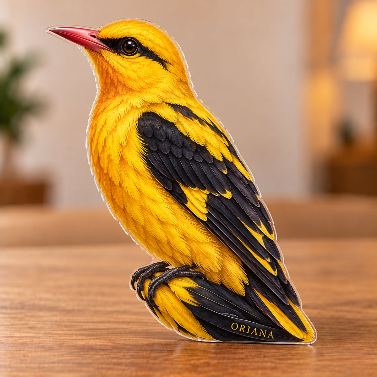 Digital preview of a golden oriole-shaped acrylic plaque with ORIANA integrated along its lowest illustrated tail feather