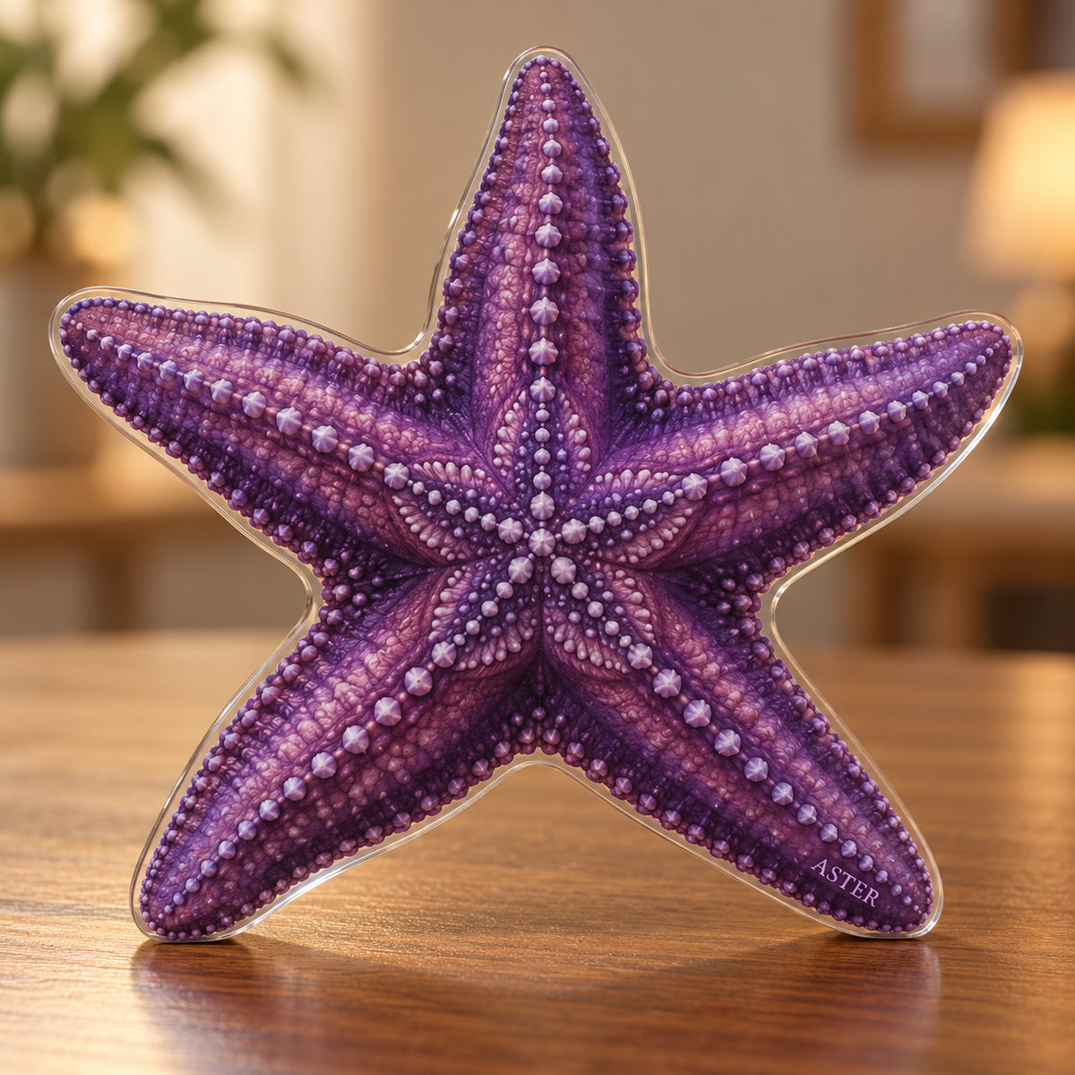 Digital preview of a purple ochre-sea-star-shaped acrylic plaque with ASTER integrated along its lowest illustrated arm