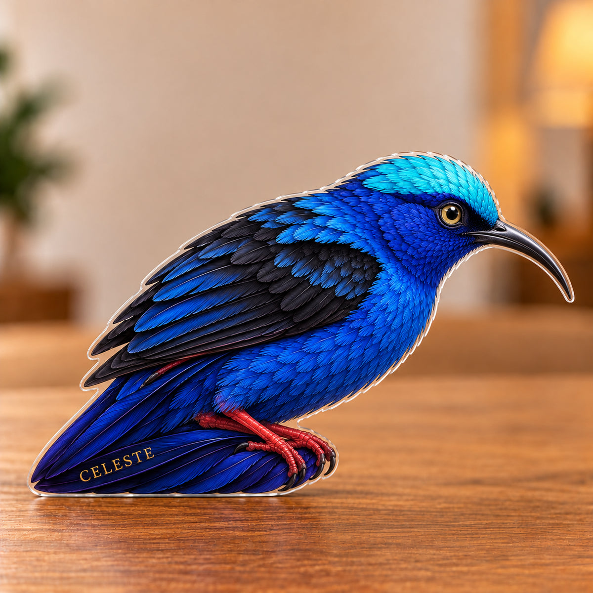 Digital preview of a red legged honeycreeper-shaped acrylic plaque with CELESTE integrated along its lowest illustrated tail feather