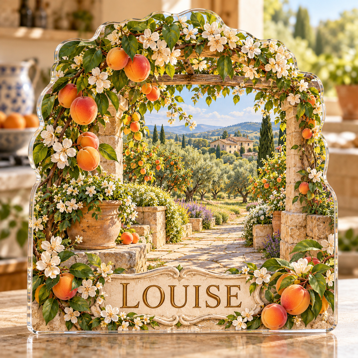 Front view of personalized apricot garden stone pergola acrylic plaque with sample name LOUISE, displayed in a softly blurred sunny orchard cottage kitchen on limestone counter