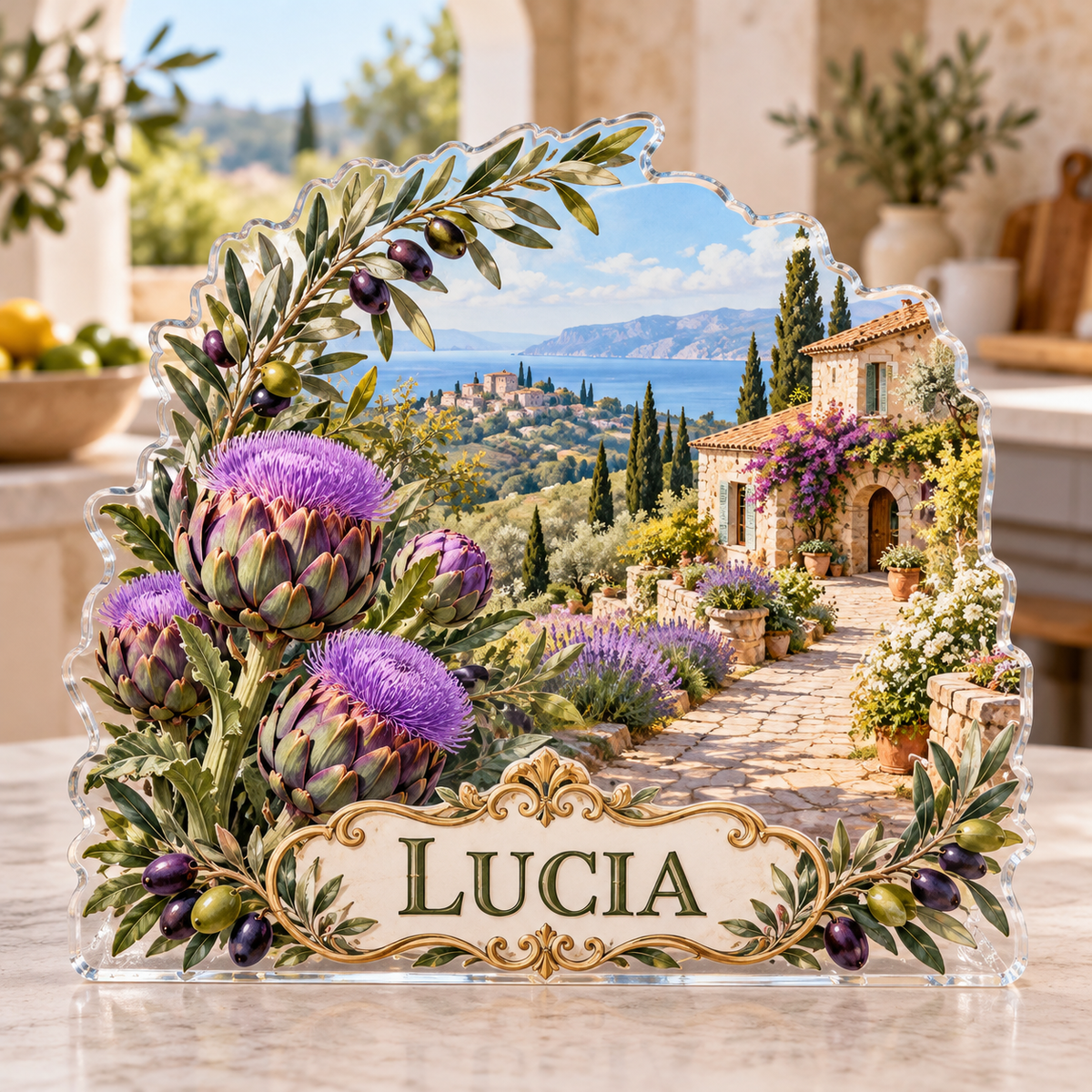 Front view of a artichoke olive villa garden custom-shape acrylic plaque with example name LUCIA, displayed in a softly blurred Mediterranean kitchen on pale stone console