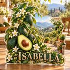 Front view of personalized avocado jasmine terraced orchard acrylic plaque with sample name ISABELLA, displayed in a softly blurred sunlit orchard kitchen