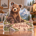 Artwork visualization: Mountain bear adventure — first birthday room keepsake, personalized SOPHIA, subject-shaped acrylic with printed optical 3D depth; not carved relief.