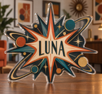 Artwork visualization: Atomic starburst — apartment gallery wall, personalized LUNA, subject-shaped acrylic with printed optical 3D depth; not carved relief.