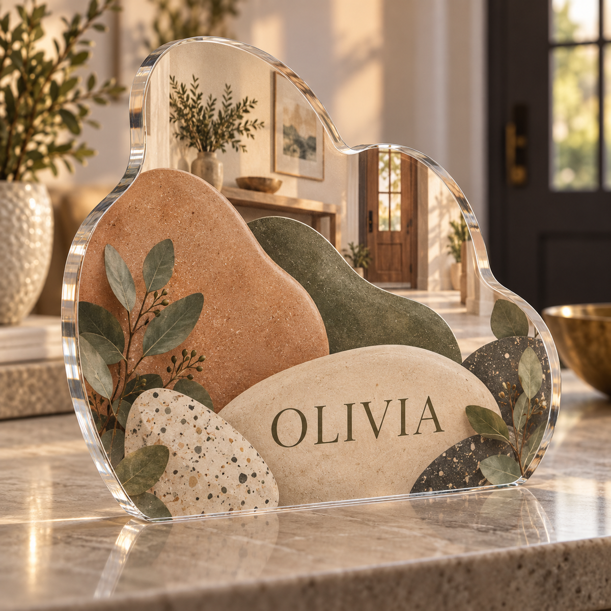 Artwork visualization: Organic pebble shapes — personalized housewarming, personalized OLIVIA, subject-shaped acrylic with printed optical 3D depth; not carved relief.
