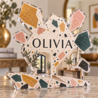 Artwork visualization: Terrazzo confetti — personalized housewarming, personalized OLIVIA, subject-shaped acrylic with printed optical 3D depth; not carved relief.