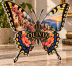 Artwork visualization: Swallowtail butterfly — apartment gallery wall, personalized OLIVIA, subject-shaped acrylic with printed optical 3D depth; not carved relief.