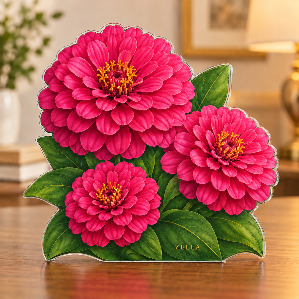 Digital preview of a magenta-pink zinnia-shaped acrylic plaque with ZELLA integrated along its lowest illustrated leaf
